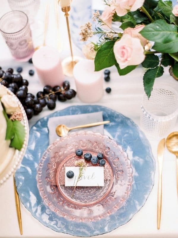 A styled spread of plates, glassware, and linens — examples of individual pieces you can rent.